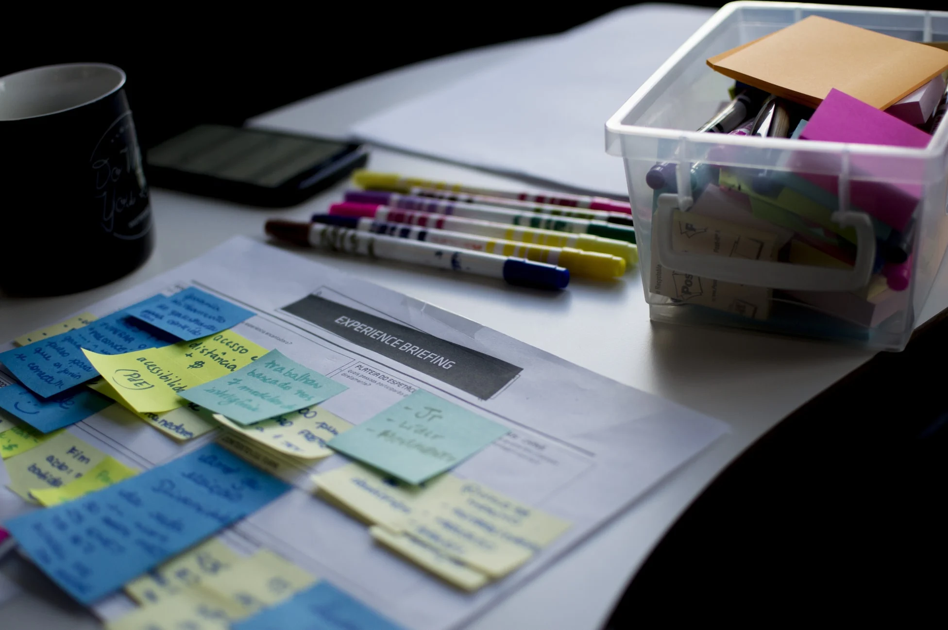 Value stream mapping materials and sticky notes on a worktable